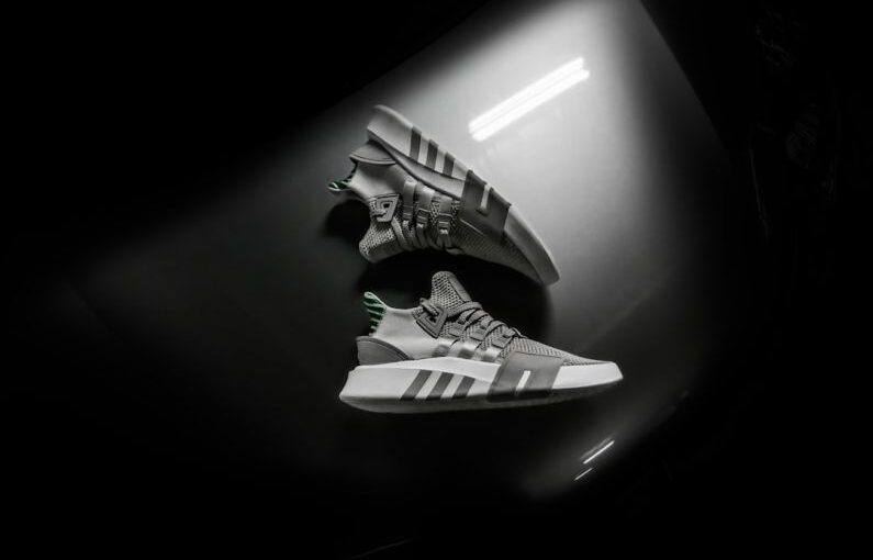 Storing Shoes - grayscale photo pair of adidas shoes