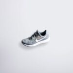 Comfortable Shoe - unpaired gray and white Nike Flyknit shoe