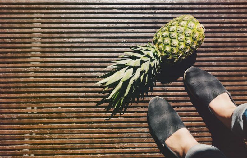 Vegan Shoes - pineapple beside person's feet