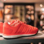 Upcycling Footwear - a pair of red shoes sitting on top of a table