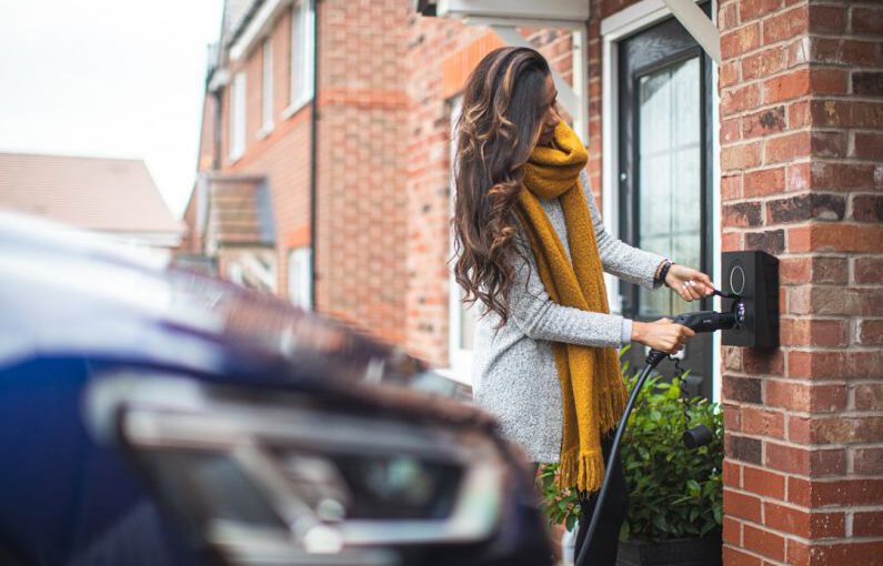 Carbon Footprint Shoes - a woman is opening the door of her house