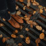 Seasonal Shoes - person wearing black leather dress shoes