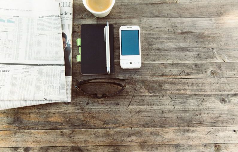 Shoe Storage - pen beside mobile phone on wooden surface