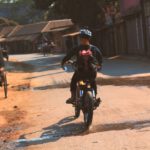 Diy Customization Shoe - a man riding a motorcycle down a dirt road