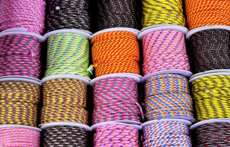 Multi-material Shoes - a bunch of different colored rope on a table