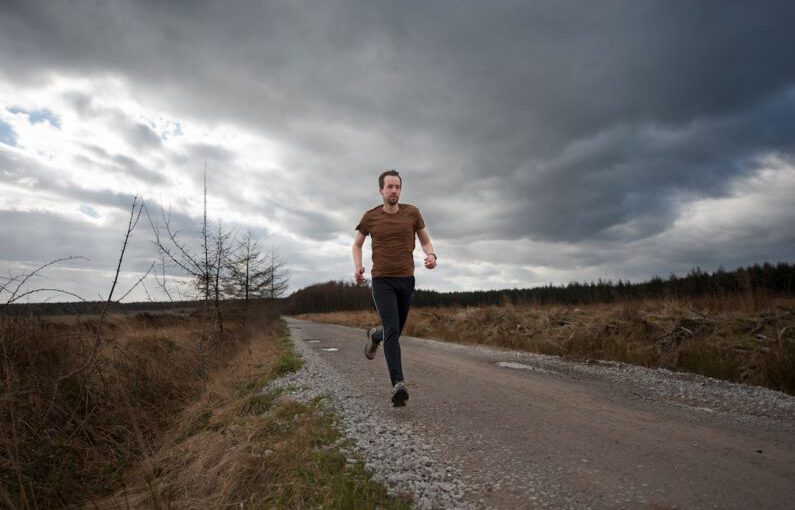 Personalizing Running Shoes - man running at the road during daytime