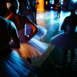 Ballet Evolution - man and woman dancing on street during night time