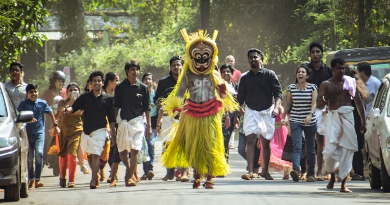 Folklore Shoes - group of people parade on the road during daytime