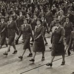 War Footwear - grayscale photography of group of women marching on road