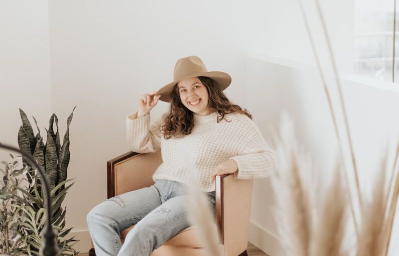 Shoe Sizes - woman in white long sleeve shirt and gray pants sitting on brown wooden seat